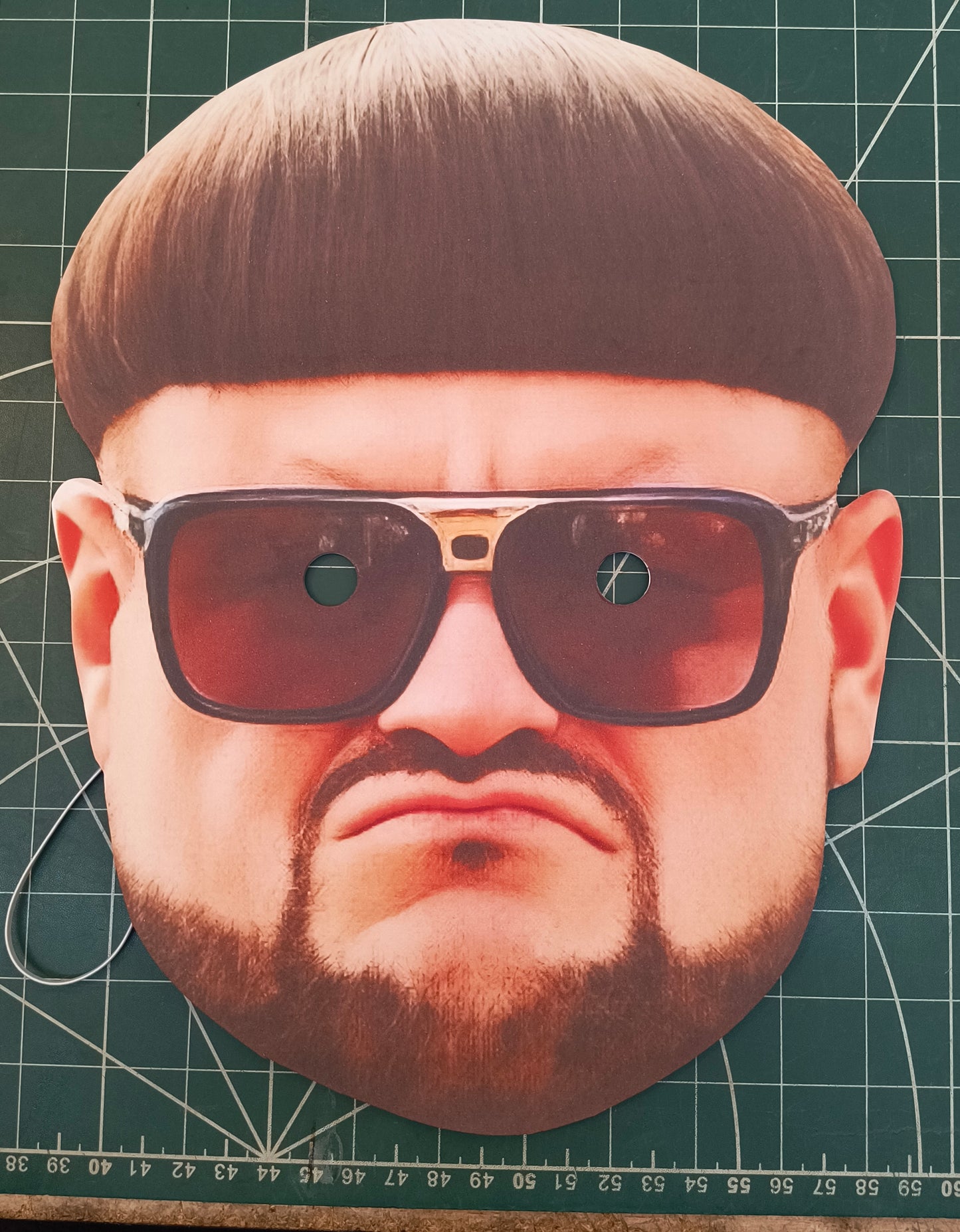 Cardboard cutout of ibiza boss with sunglasses and a hairstyle