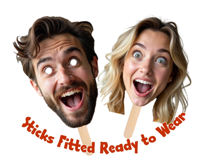 Two cardboard face masks of a man and woman on sticks with text 'Sticks Fitted Ready to Wear' on a white background.